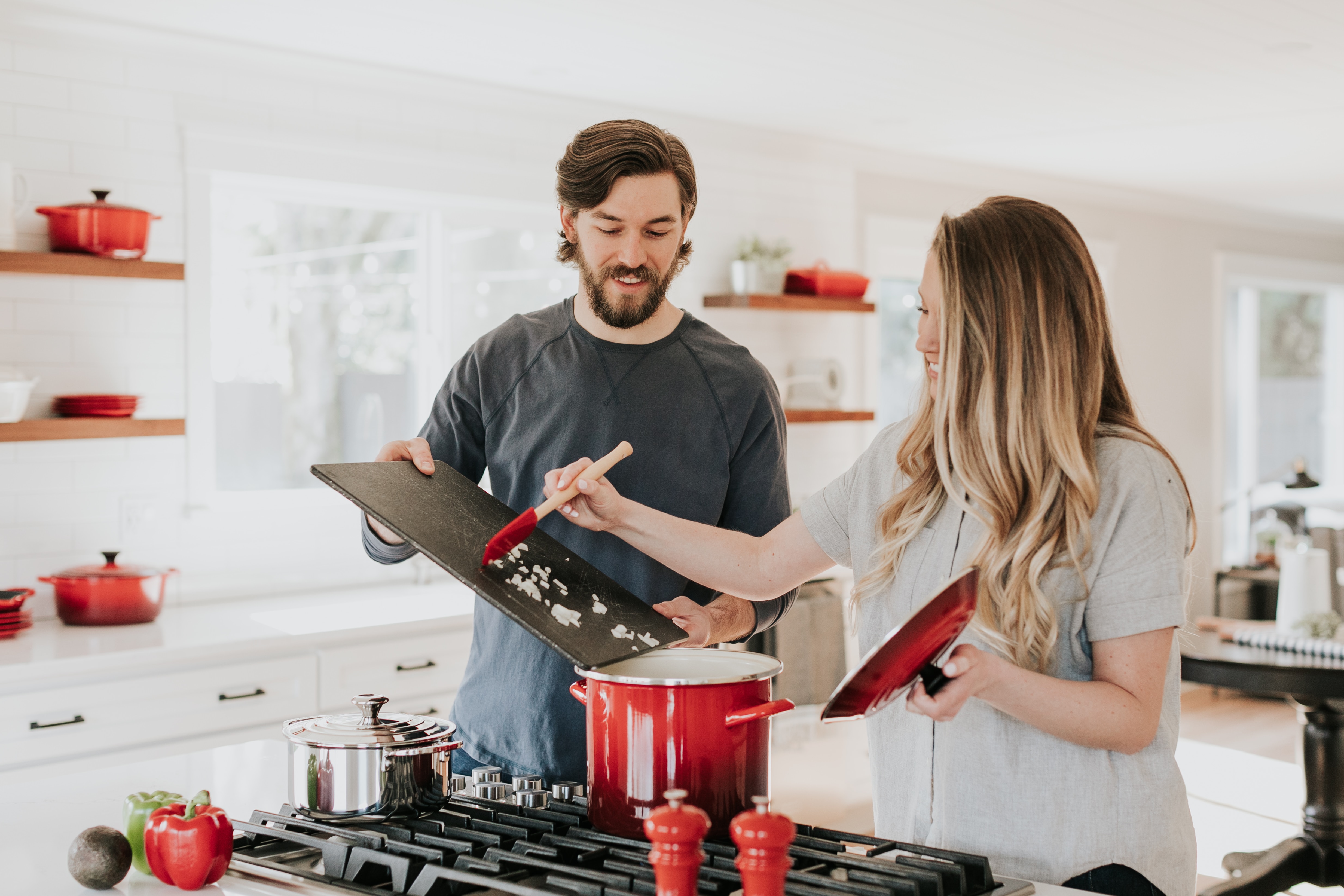 Couple in their kitchen, cooking dinner together